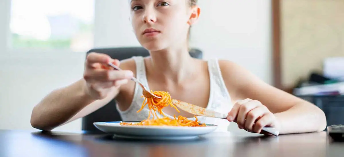 Teenager eating at home